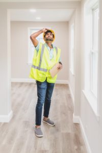 man inspecting the ceiling