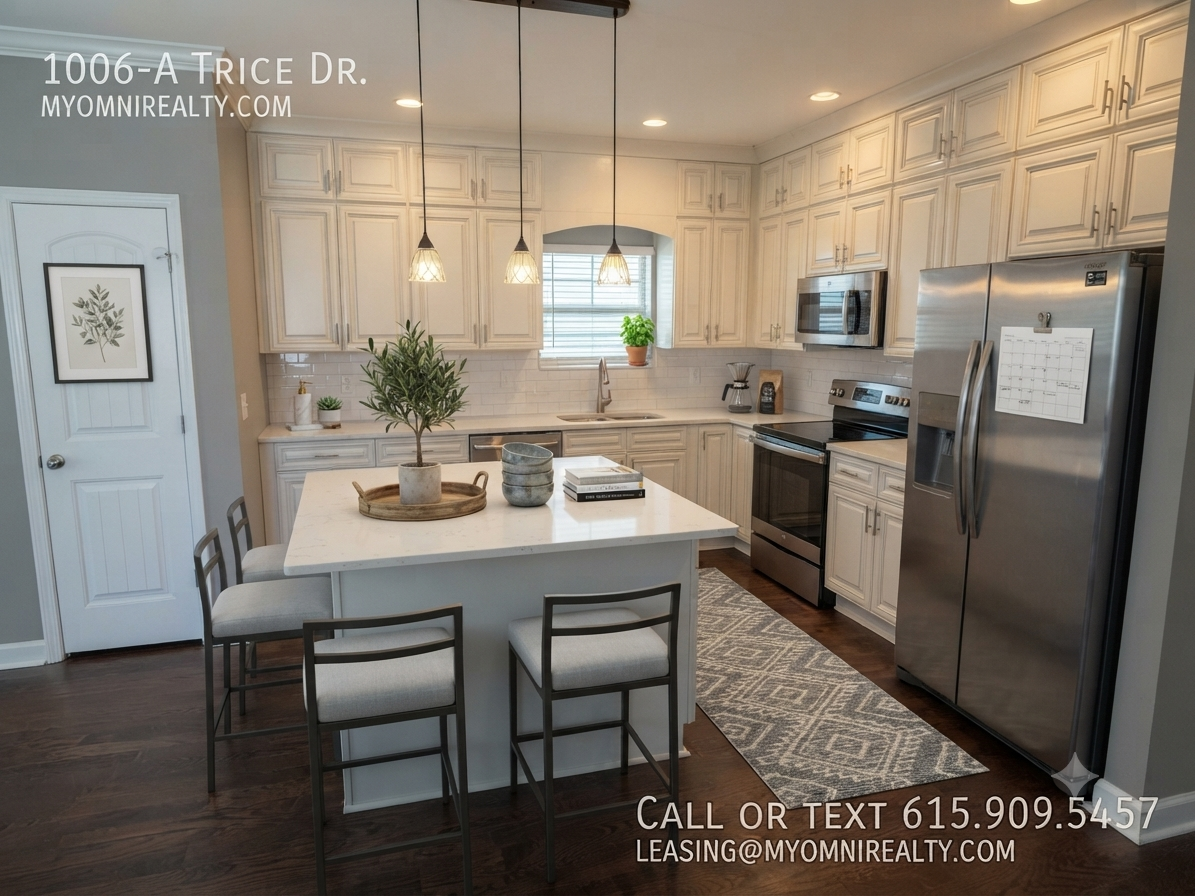 Kitchen with white shaker cabinets, stainless steel appliances, and a large island with seating; pendant lights above the island. Overlay text shows 1006-A Trice Dr. and myomnirealty.com, plus call/text 615.909.5457 and leasing@myomnirealty.com.